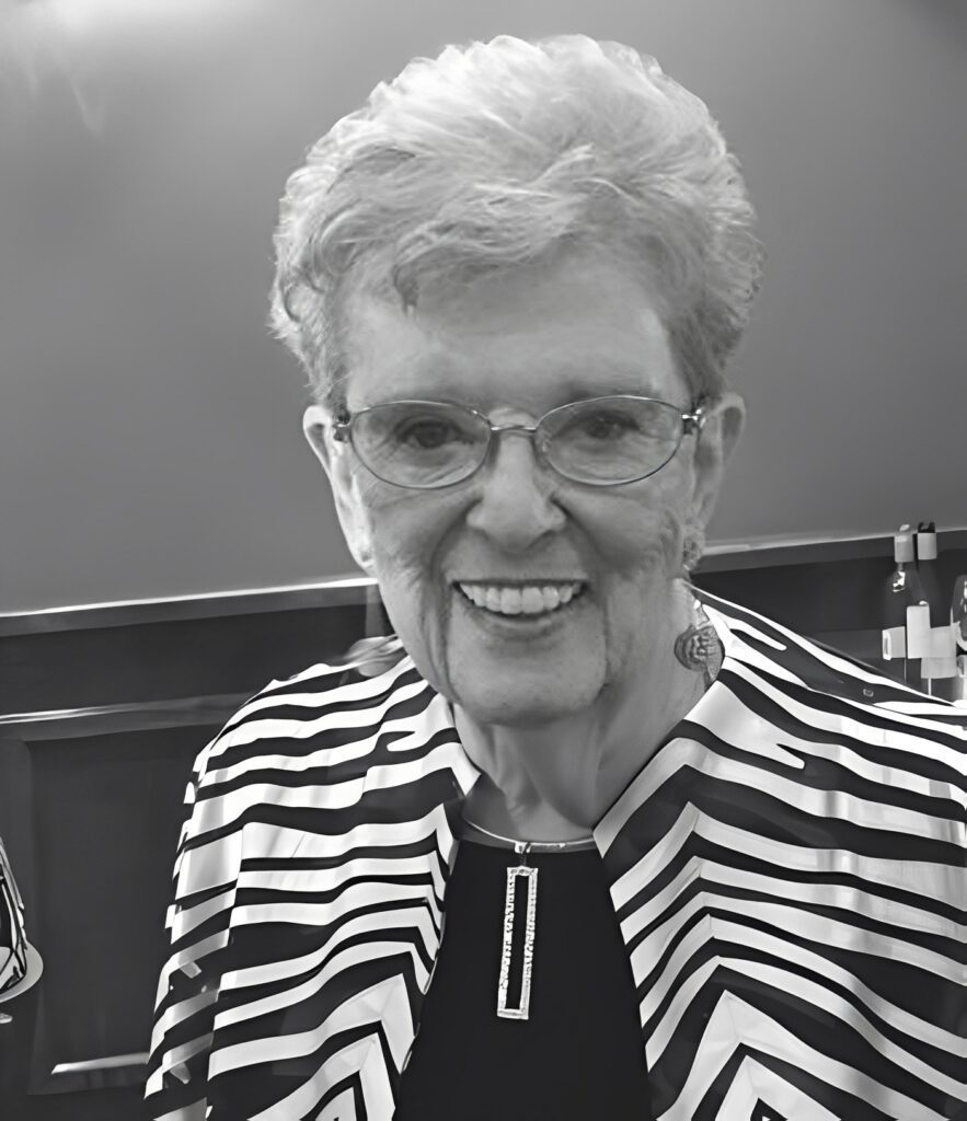 Smiling woman with glasses in striped jacket