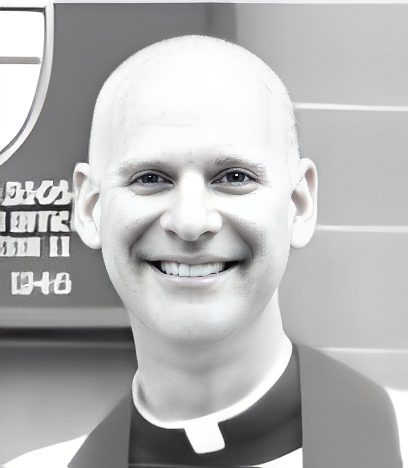 Smiling priest wearing clerical collar