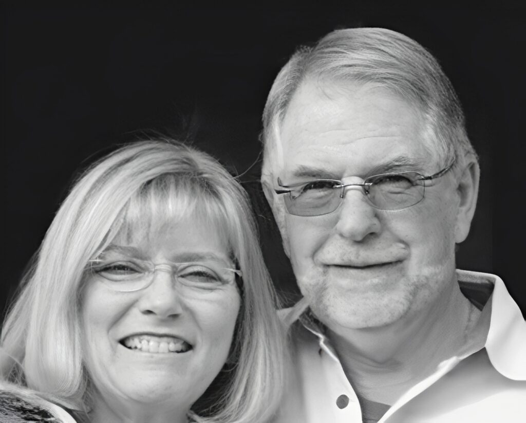 Smiling older couple portrait, black and white