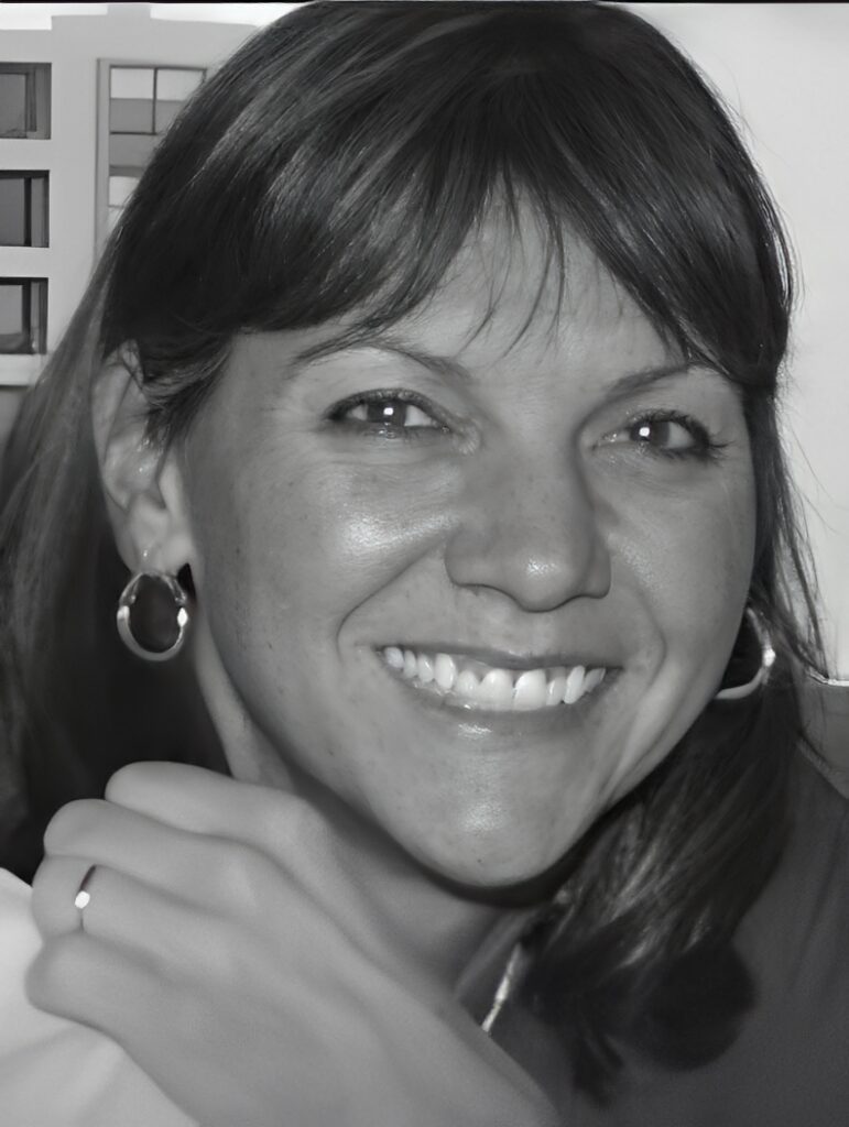 Close-up of smiling woman with hoop earrings